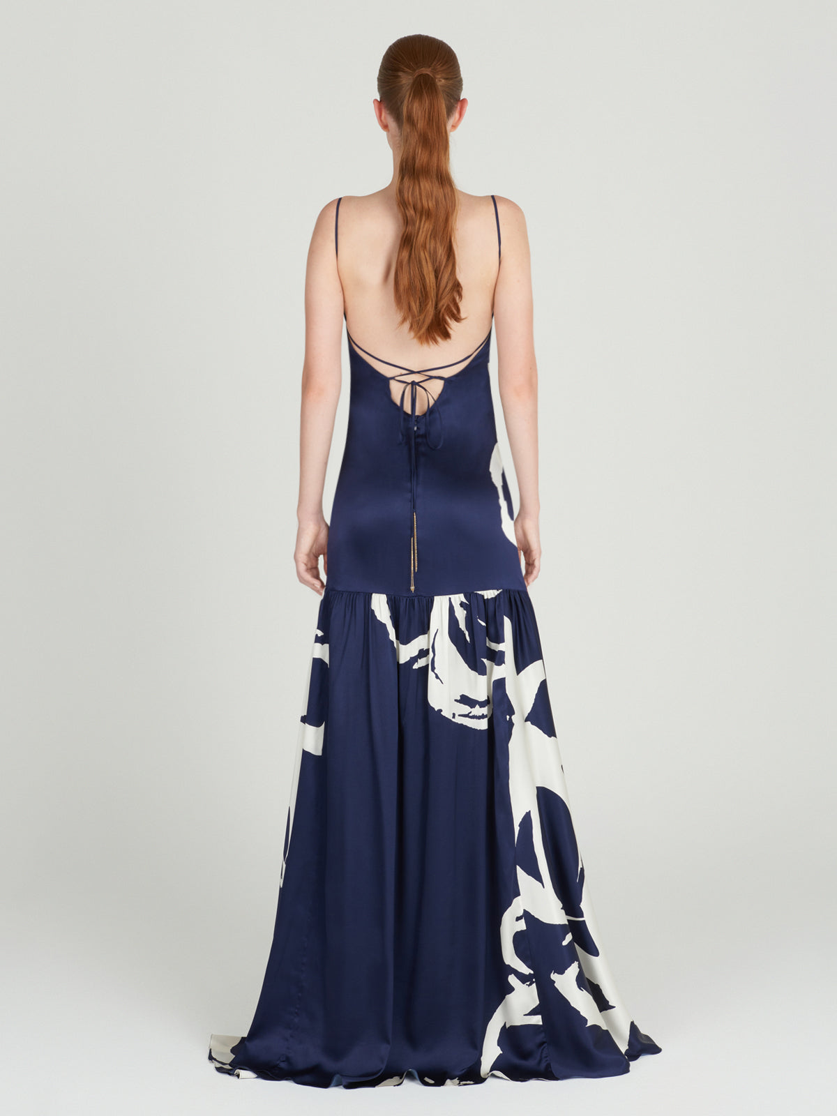 A Bari Dress Midnight Bloom with a floral design on it.