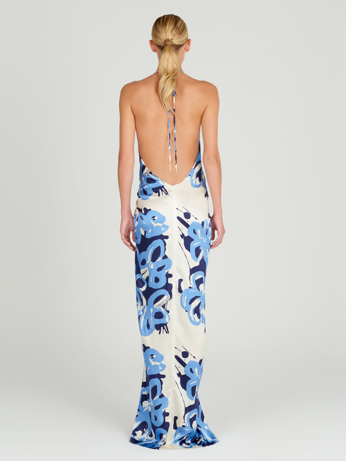 A Jazmin Dress White Celeste Bloom cocktail dress with a halter neckline, perfect for the Resort 2024 season.