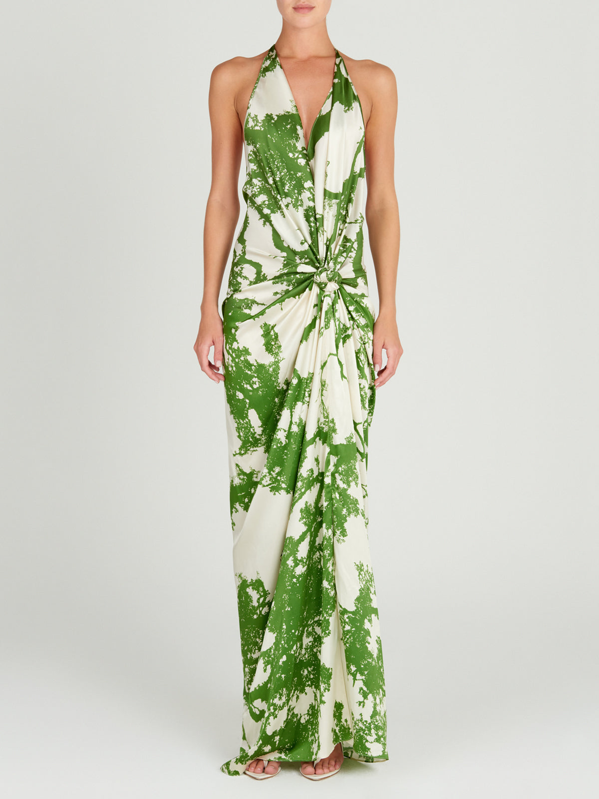 A Jazmin Dress Green Cyprus with a halter neck in green and white, perfect for Resort 2024.