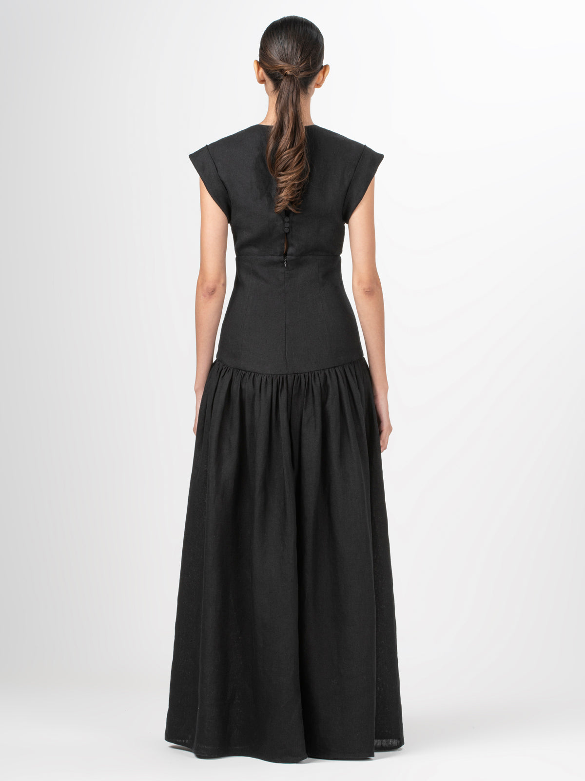 A Hanane Dress Black with guipure lace detailing.