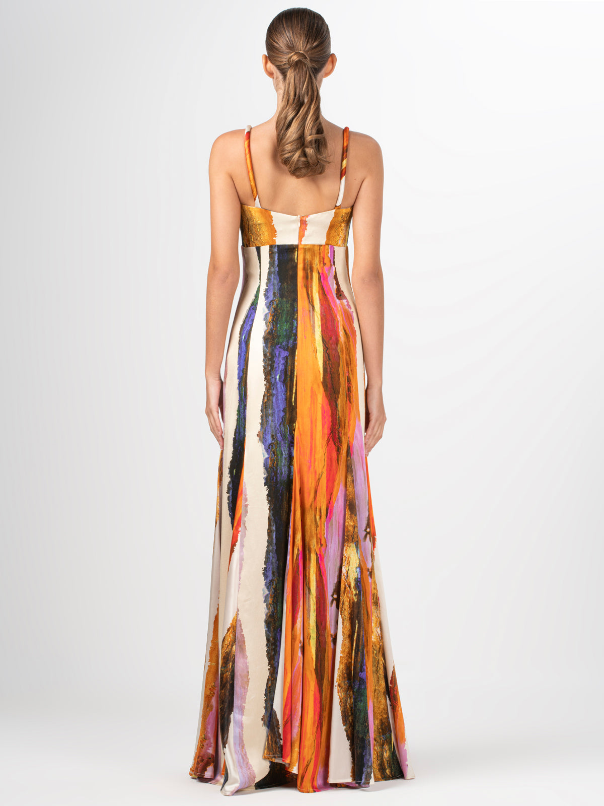 A Artis Dress Orange Orchid Abstract with an abstract multicolor print displayed on a mannequin, giving it a 3D feel.
