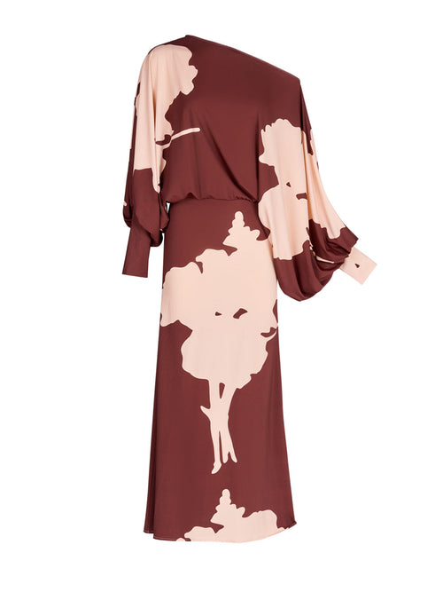 A Calta Dress Cacao Floral with batwing sleeves in a floral print.