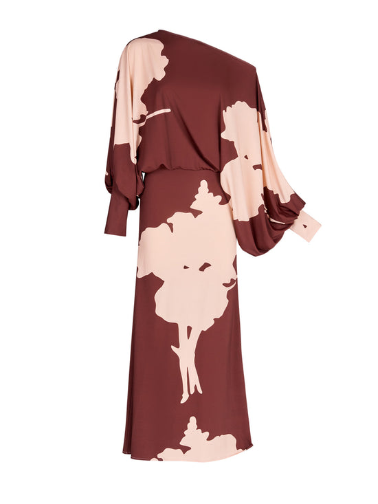 A Calta Dress Cacao Floral with batwing sleeves in a floral print.