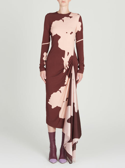 A burgundy midi Ananya Dress Cacao Floral with long sleeves in a botanical-inspired print.