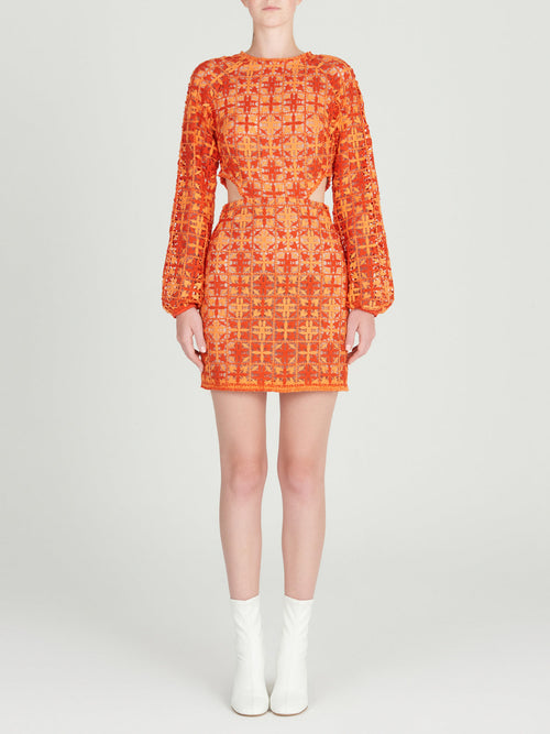 A figure-flattering Janis Dress Red Orange Crochet displayed on a mannequin.