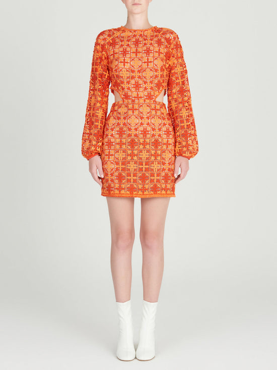 A figure-flattering Janis Dress Red Orange Crochet displayed on a mannequin.