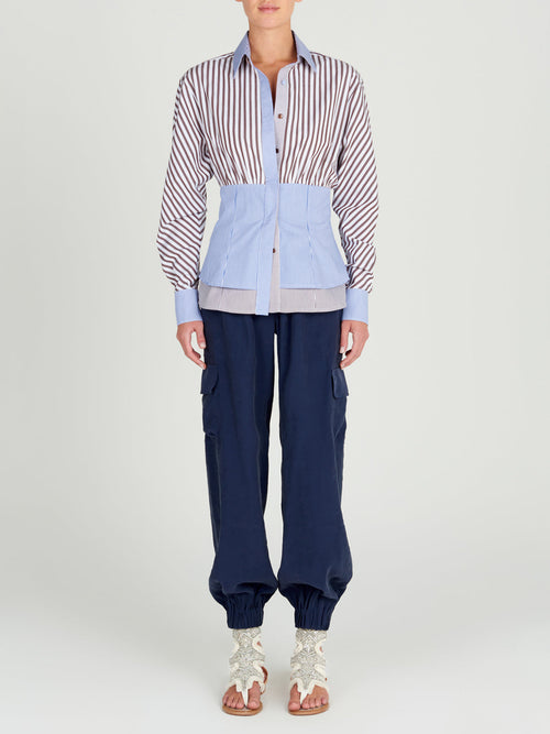 A pair of Jess Pant Navy with an elastic waistband and pockets.