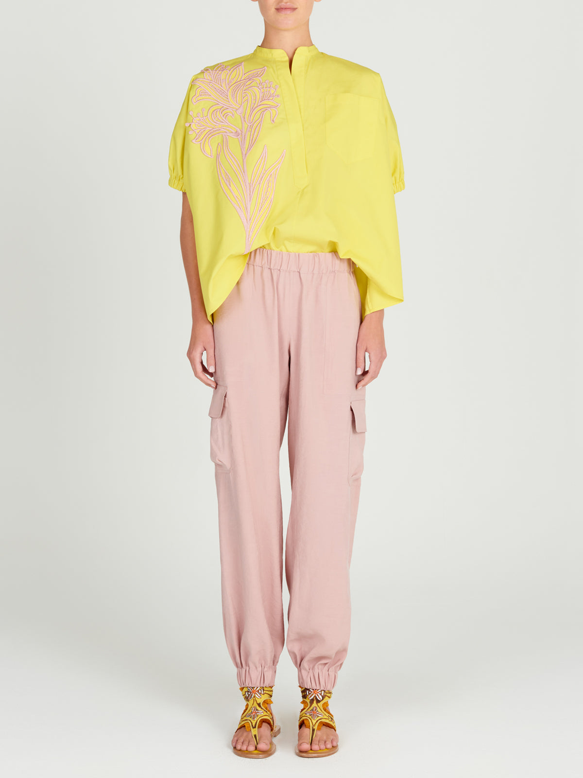 A Susanne Blouse Limoncello with a pink floral design.
