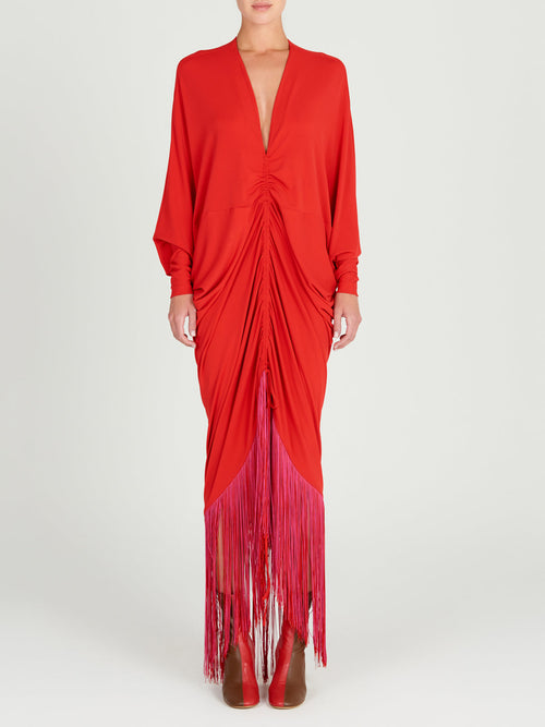 A red Rosalyn Dress Rouge with long sleeves made of jersey fabric.