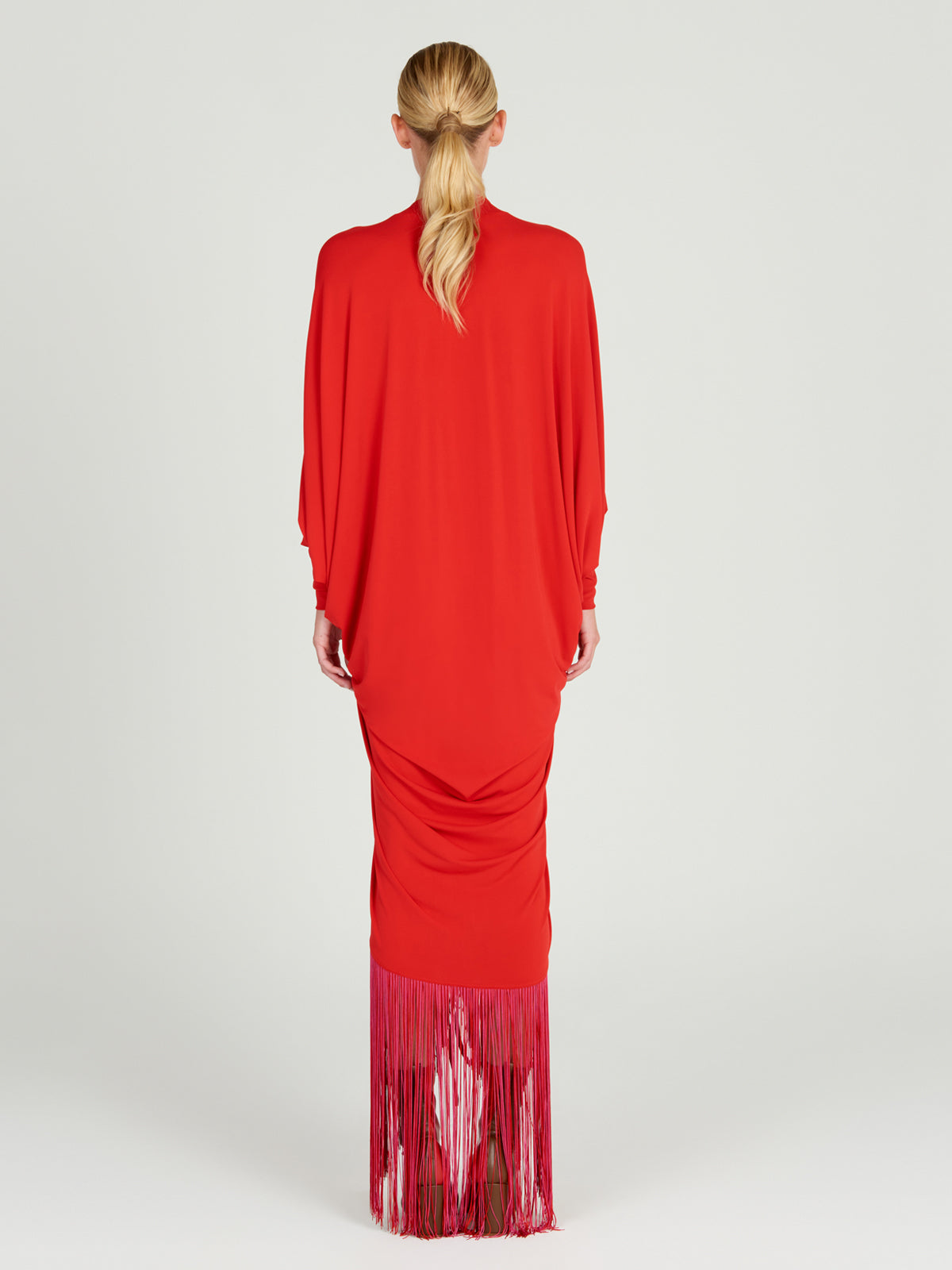 A red Rosalyn Dress Rouge with long sleeves made of jersey fabric.