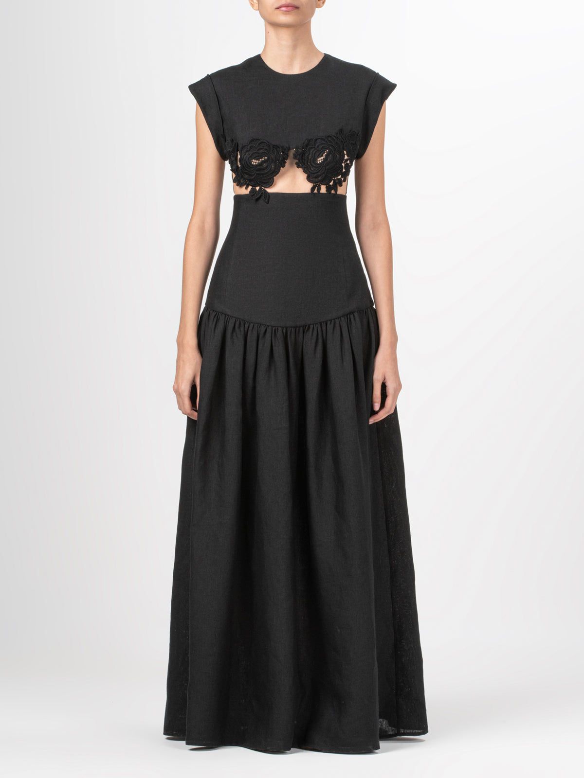 A Hanane Dress Black with guipure lace detailing.