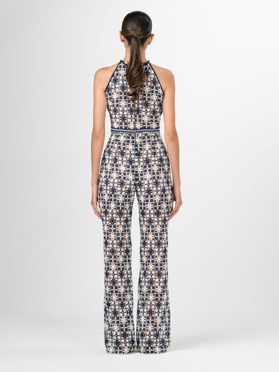 A Joan Pant Navy White Crochet with a pattern in lace fabric.