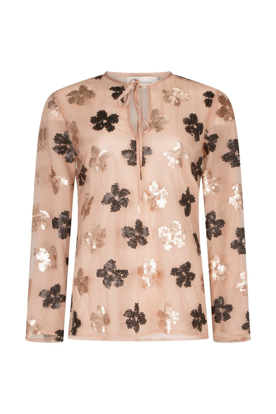A Tosca Blouse Cacao Floral Sequin with black lace and gold sequins on it.