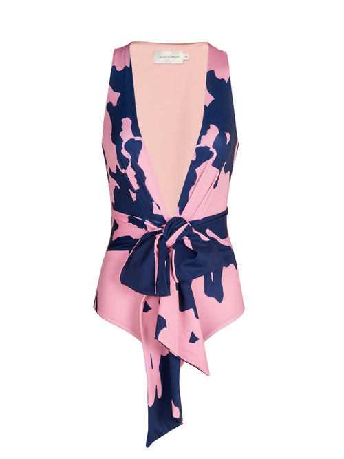 A Zaita One Piece Pink Navy Blossom with a bow on the back, made from lycra fabric.